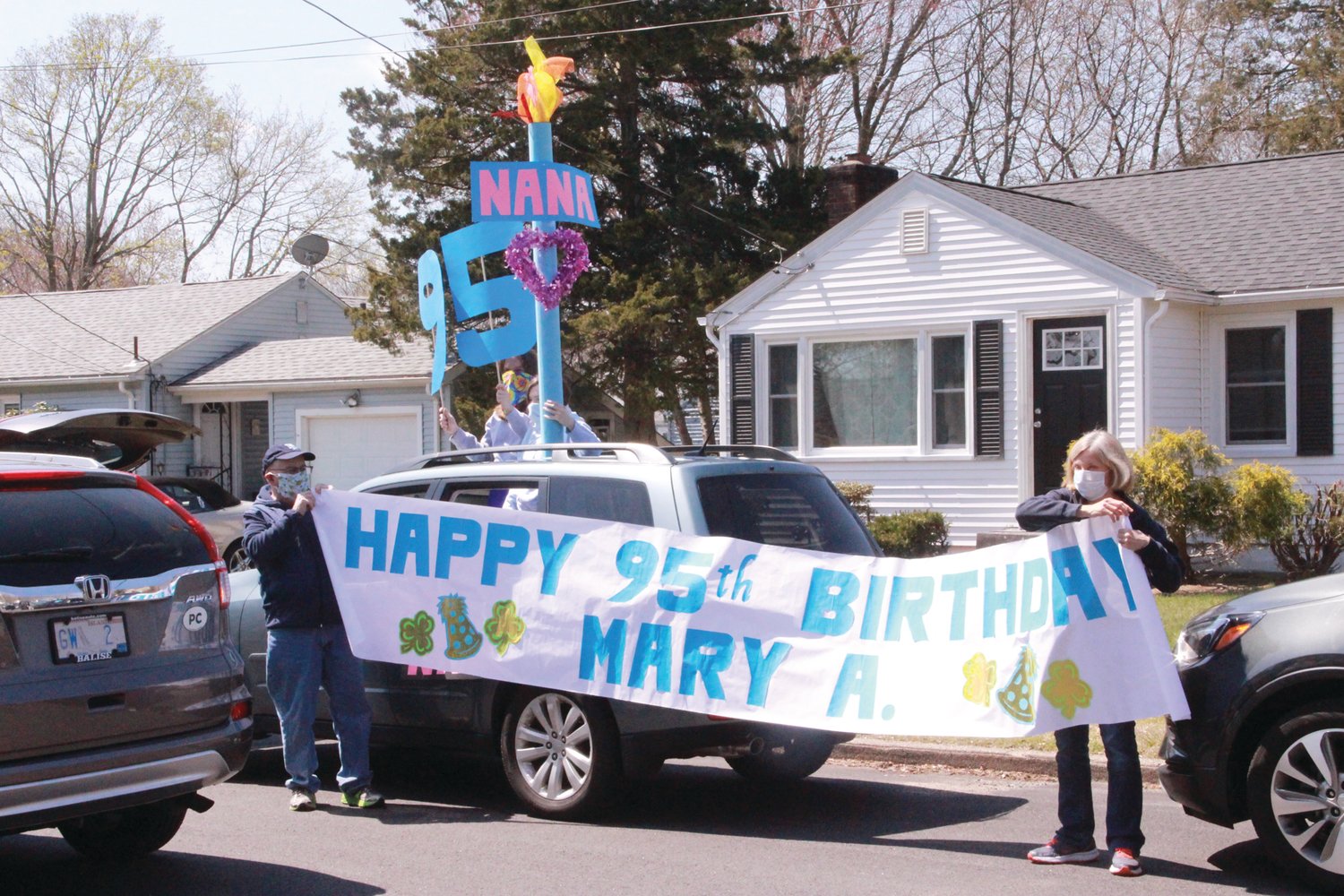 Drive-by birthday celebrations like this one  for Mary Whalen became popular.